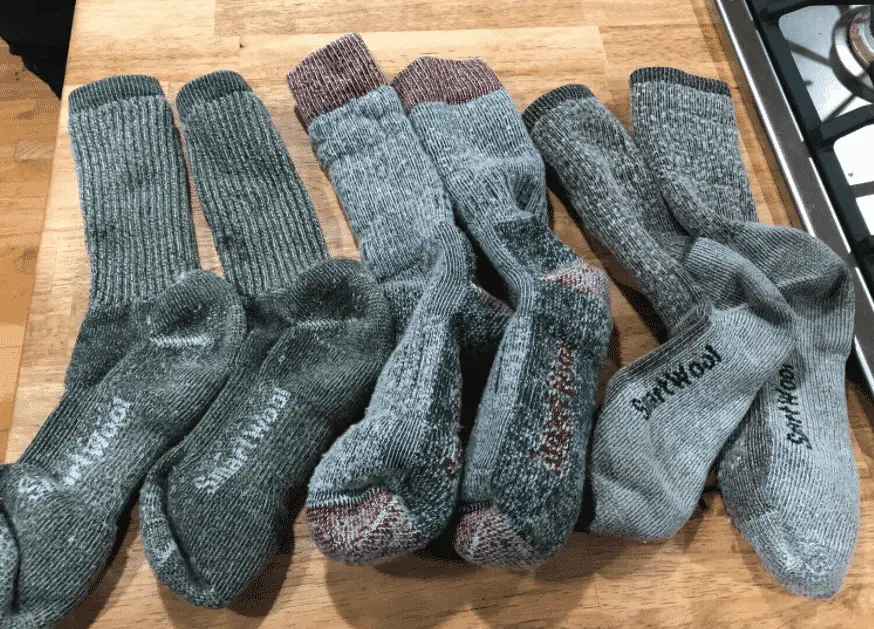 wear merino wool socks to keep hiking boots warm in the snow.