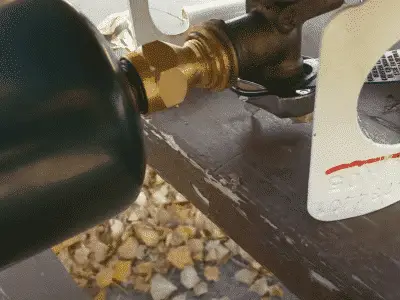 1lb propane bottle being refilled