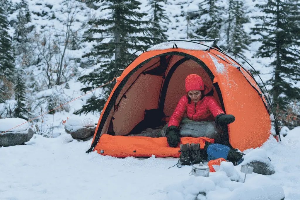 Woman Camping In The Cold Snow